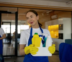 view professional cleaning service person holding supplies (3)